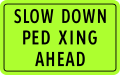 Slow down, pedestrian crossing ahead (plate type)