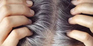 Visual representation of the stress-gray hair connection, with a worried person and strands of gray hair emerging.