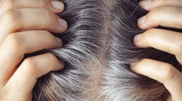 Visual representation of the stress-gray hair connection, with a worried person and strands of gray hair emerging.