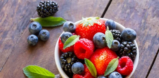 Assorted fresh fruits represent eye-boosting nutrients.