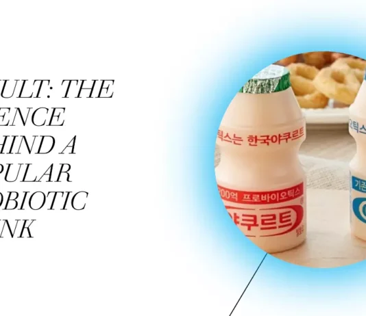 A glass of Yakult probiotic drink symbolizes the scientific foundation of its wellness advantages.