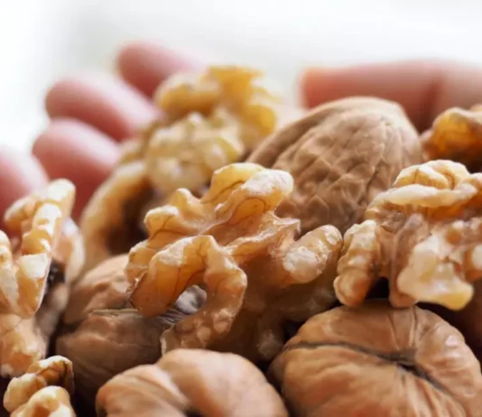 A pile of walnuts symbolizes the potential benefits of walnuts for memory and brain health.