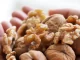 A pile of walnuts symbolizes the potential benefits of walnuts for memory and brain health.