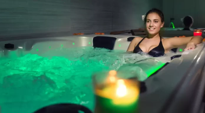 A person enjoying a relaxing hot bath symbolizes the soothing and holistic wellness effects of regular hot water therapy.