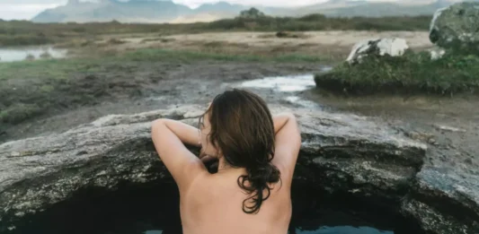 Picture someone immersed in a cold water bath—it represents how refreshing and revitalizing cold water can be for your well-being.