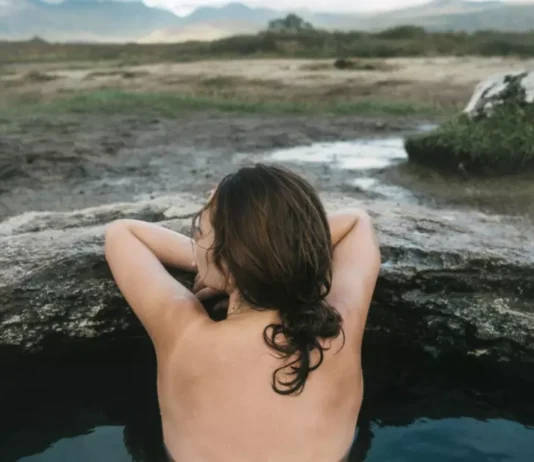 Picture someone immersed in a cold water bath—it represents how refreshing and revitalizing cold water can be for your well-being.