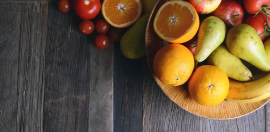 See the vibrant world of fruits—blueberries, carrots, oranges, strawberries, papaya, kiwi, and avocado—all representing the top 7 fruits that enhance and restore vision.