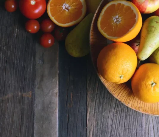 See the vibrant world of fruits—blueberries, carrots, oranges, strawberries, papaya, kiwi, and avocado—all representing the top 7 fruits that enhance and restore vision.