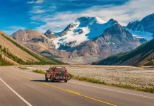 A happy family enjoying outdoor life in Canada with scenic mountains in the background.