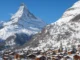 Snow-covered Zermatt village beneath the Matterhorn in the Swiss Alps during winter.