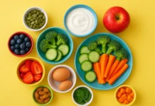 10 Kid-Friendly Superfoods Every Parent Should Know A top view of various healthy superfoods like fruits, yogurt, and nuts arranged on a bright table for kids