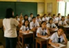 Crowded classroom with Filipino students and a teacher in the Philippines