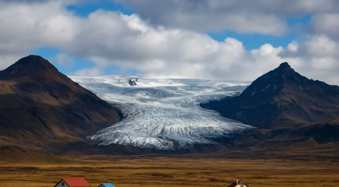 Iceland landscape showing glaciers, volcanoes, and rural terrain under cloudy skies.