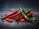 Red and green chili peppers on a dark background reflect the measurable effects of spicy foods on metabolism and overall health.
