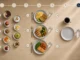 Realistic visual showing different meal timing schedules with a clock and healthy meals representing metabolism and eating frequency