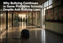 Students walking through a Philippine school hallway while a concerned teacher observes bullying, illustrating why bullying continues despite anti-bullying laws.